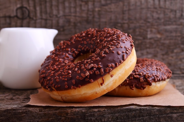 Donuts with chocolate on a dark background