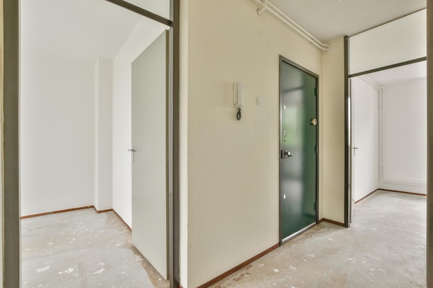 Doorway of modern apartment with white walls and parquet floor