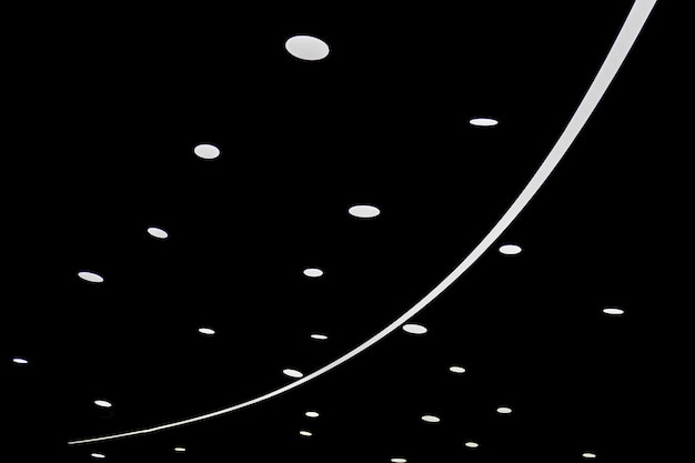 Dots and lines of light created by a lamp on a black background Bright color LED SMD screen Technological or electronic conceptual background