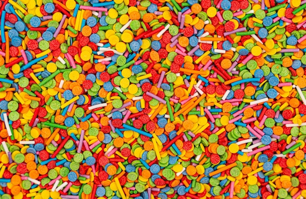 Dots of sugar sprinkles cake and pastry decoration lots of sprinkles as a background