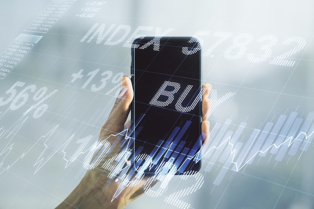 Double exposure of abstract creative financial diagram and hand with cellphone on background banking and accounting concept