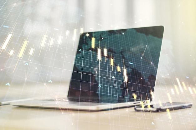 Double exposure of abstract creative financial diagram with world map on computer background banking and accounting concept