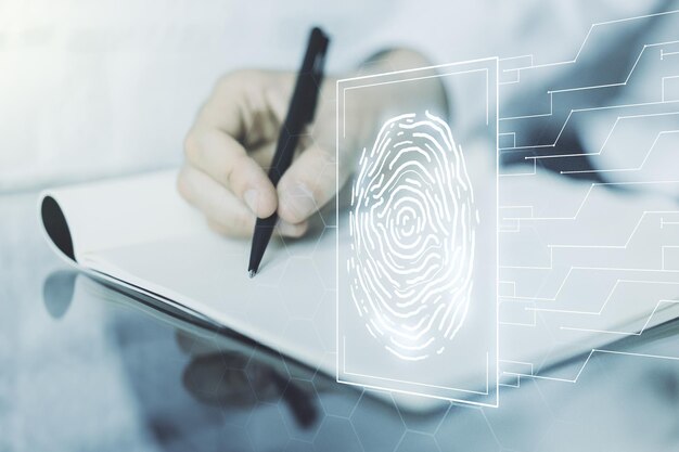 Double exposure of abstract creative fingerprint hologram with man hand writing in notebook on background research and development concept