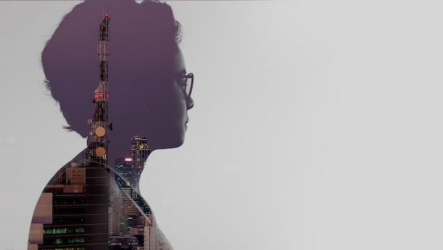 Double exposure of Asian woman and Telecommunication tower with 5G cellular network on smart city