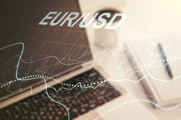 Double exposure of creative EURO USD forex chart hologram on laptop background Banking and investing concept