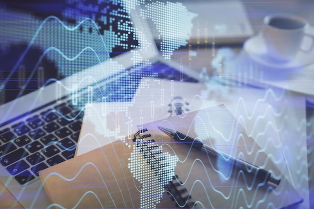 Double exposure of financial chart drawing and desktop with coffee and items on table background Concept of forex market trading