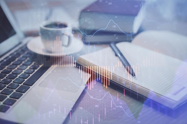 Double exposure of forex chart drawing and desktop with coffee and items on table background Concept of financial market trading