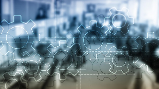 Double exposure gears mechanism on blurred background Business and industrial process automation concept