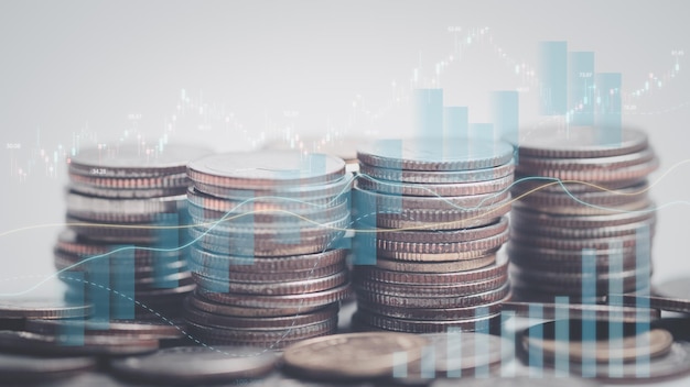 Double exposure of graph and rows of coins for finance saving banking business concept