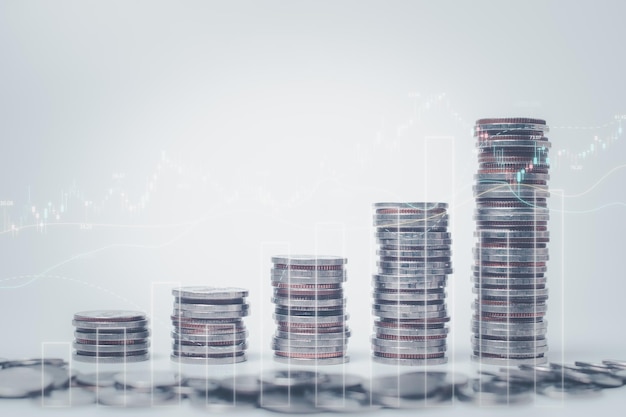 Double exposure of graph and rows of coins for finance saving banking business concept