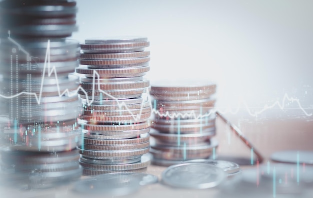 Double exposure of graph and rows of coins for finance saving banking business concept