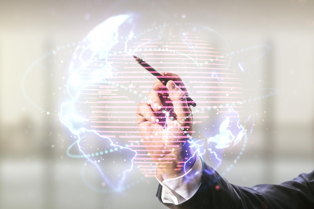 Double exposure of man hand with pen working with abstract digital world map hologram with connections on blurred office background big data and blockchain concept