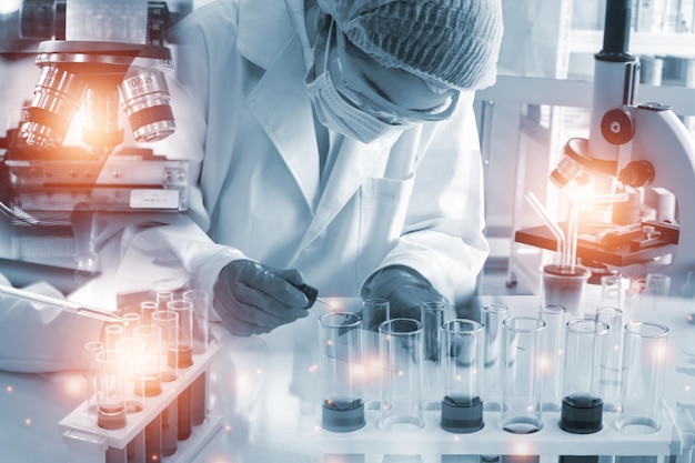 Double exposure microscope Young woman scientific using equipment in the laboratory for research