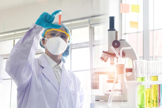 Double exposure microscope Young woman scientific using equipment in the laboratory for research