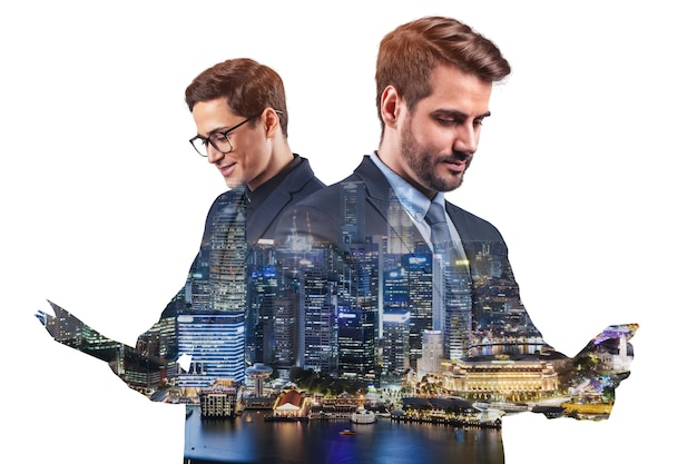 Double exposure of two young successful business people man standing in front of Asian city Singapore background Concept of teamwork Night time