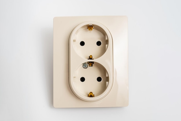 Double socket insulated on a white background 2 sockets connected by one monolithic housing The socket has two plug connectors but is installed in one standard socket