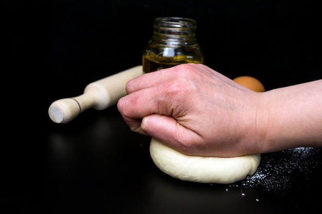 Dough on a black background close up