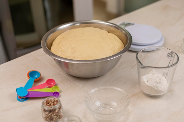 Dough for bread of the dead resting in a bowl in a Mexican kitchen