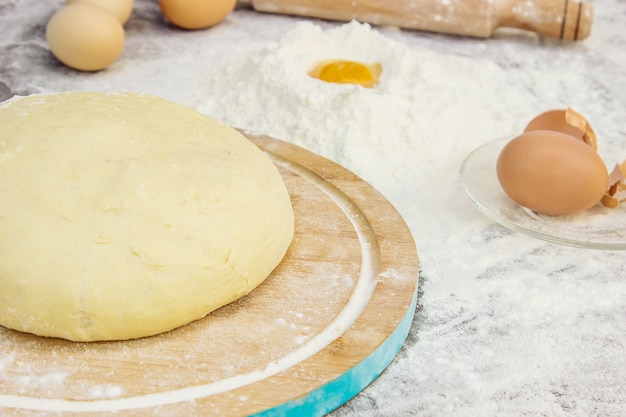 Dough on a dark background. Selective focus.