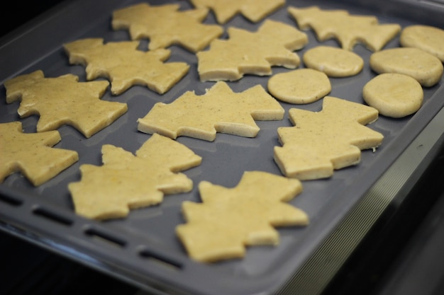 Dough in the form of a Christmas tree figure, baking in the oven