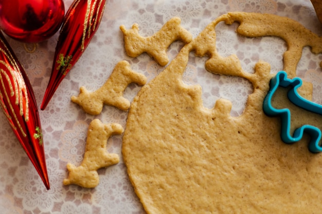 Dough on ginger biscuits with a mould in the form of a bull