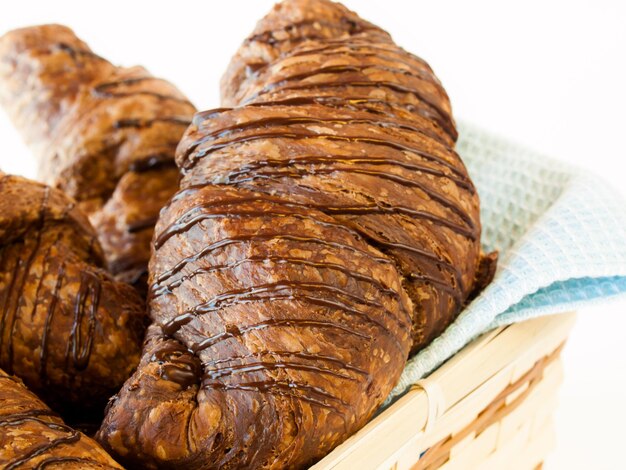 The dough is layered with butter, rolled and folded several times in succession, then rolled into a sheet, in a technique called laminating.