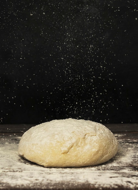 dough kneading on wooden table