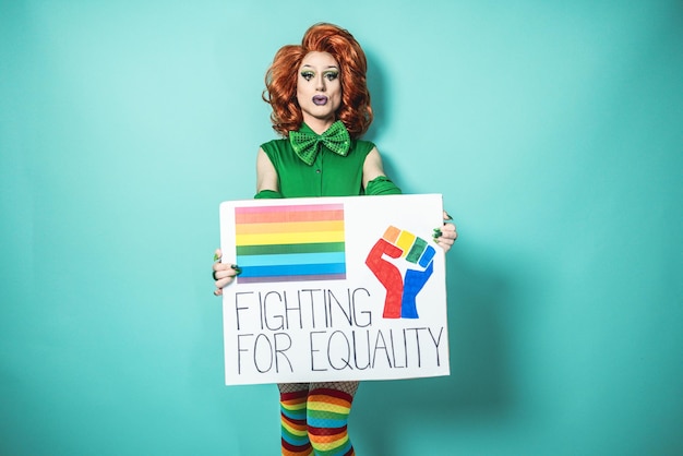 Drag queen holding lgbt banner  Focus on face