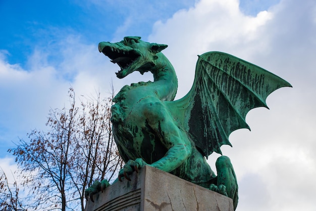 Dragon Statue on Dragon Bridge on a sunny day in Ljubljana capital of Slovenia