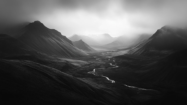 Photo dramatic black and white landscape of a misty valley with flowing river in the mountains at dawn