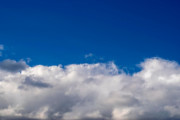 Dramatic blue sky and warm light clouds at sunrise time