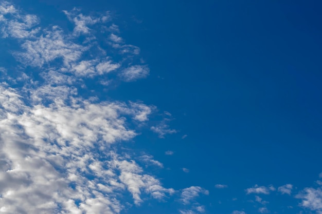 Dramatic blue sky and warm light clouds at sunrise time