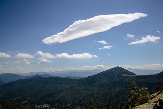 Dramatic clouds in the overcast sky view Climate environment and weather concept sky panoramic background Mount Khomyak Gorgany the Carpathian Mountains Ukraine