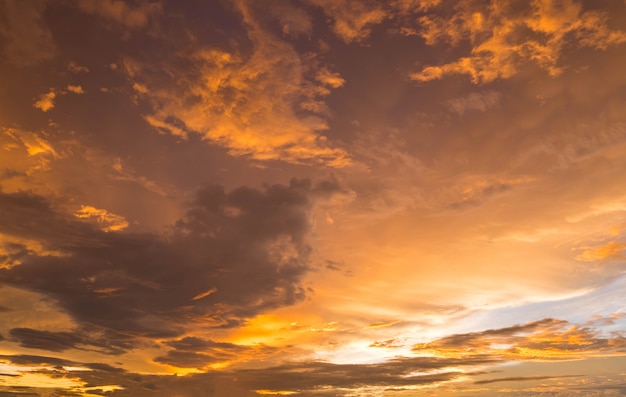 Dramatic golden sunset and sunrise over mountain morning twilight evening sky.