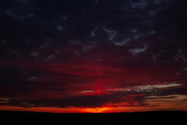 Dramatic landscape of beautiful sunset with dark clouds