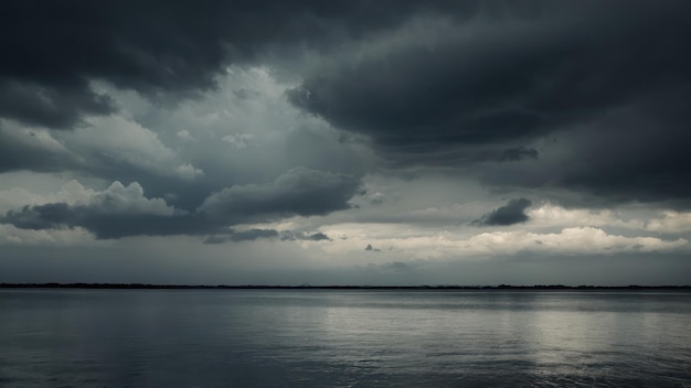 Dramatic and moody image of an overcast stormy sky reflecting over a still lake