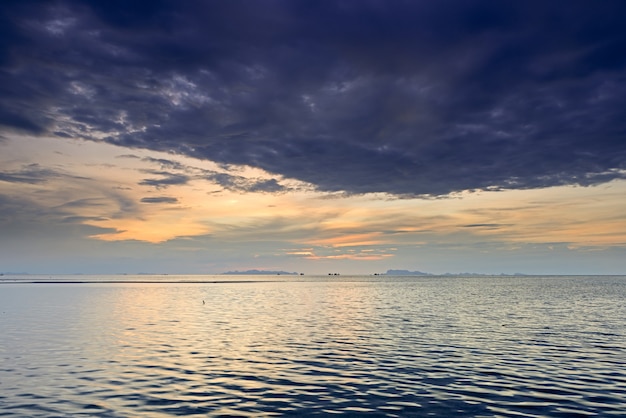 Dramatic rain cloud, sea and sky at dusk