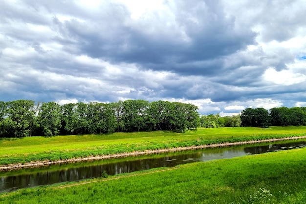 Dramatic sky before a thunderstorm on the riverbank