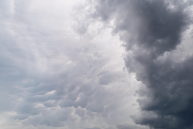 Dramatic sky with mammatus Mastodontic cloud with altocumulus