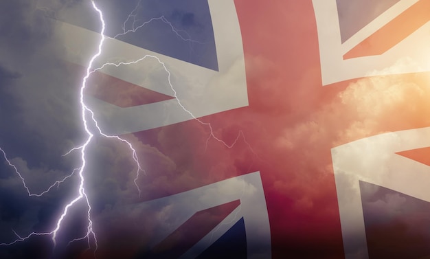 Dramatic stormy clouds with lightning next to UK flag Upcoming crisis and economy problems in Britan Huge inflation in economy in UK