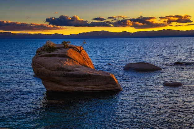 Dramatic sunset over the bonsai rock of lake tahoe nevada