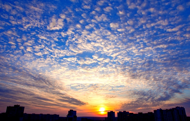 Dramatic sunset sky background with fiery clouds 