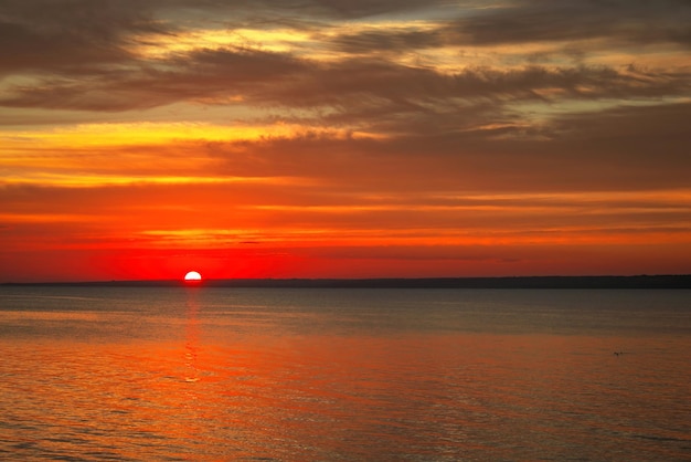 Dramatic sunset sky with clouds Breathtaking sunset over the sea