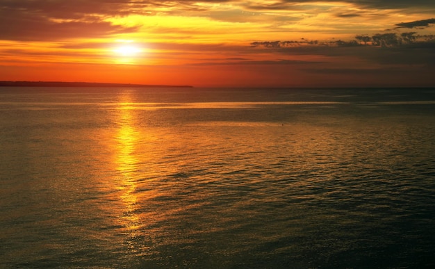 Dramatic sunset sky with clouds Breathtaking sunset over the sea