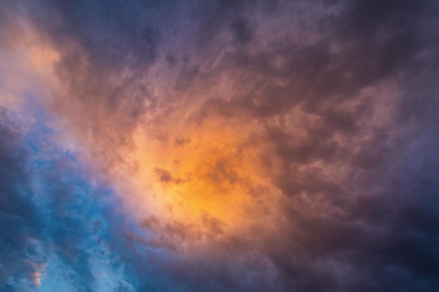 Dramatic sunset sky with heavy storm clouds