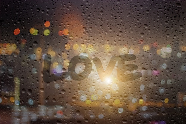 Photo draw love on window at night background