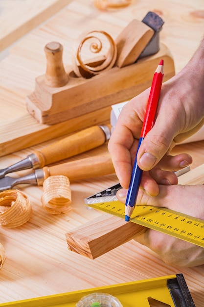 Drawing with pencil on wooden plank construction concept