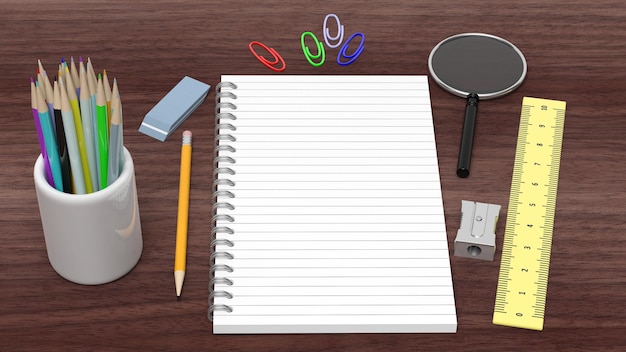 Drawingwriting tools and blank notepad on wooden desk