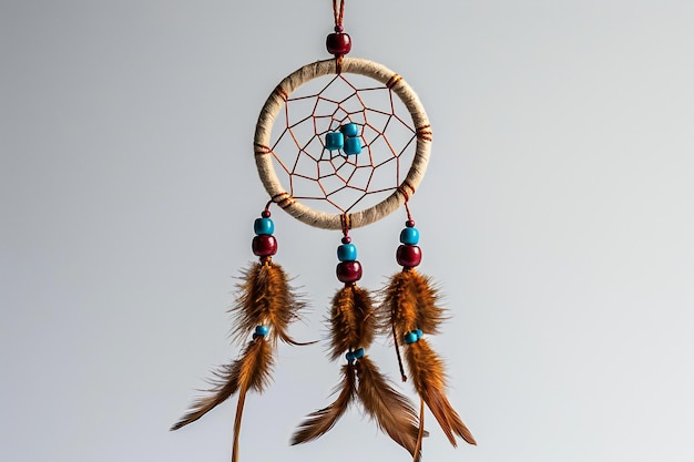 Photo a dream catcher made of feathers and beads