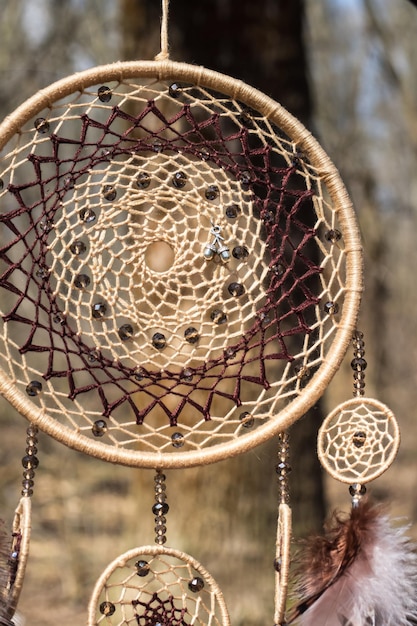 Dream catcher with feathers threads and beads rope hanging. Dreamcatcher handmade